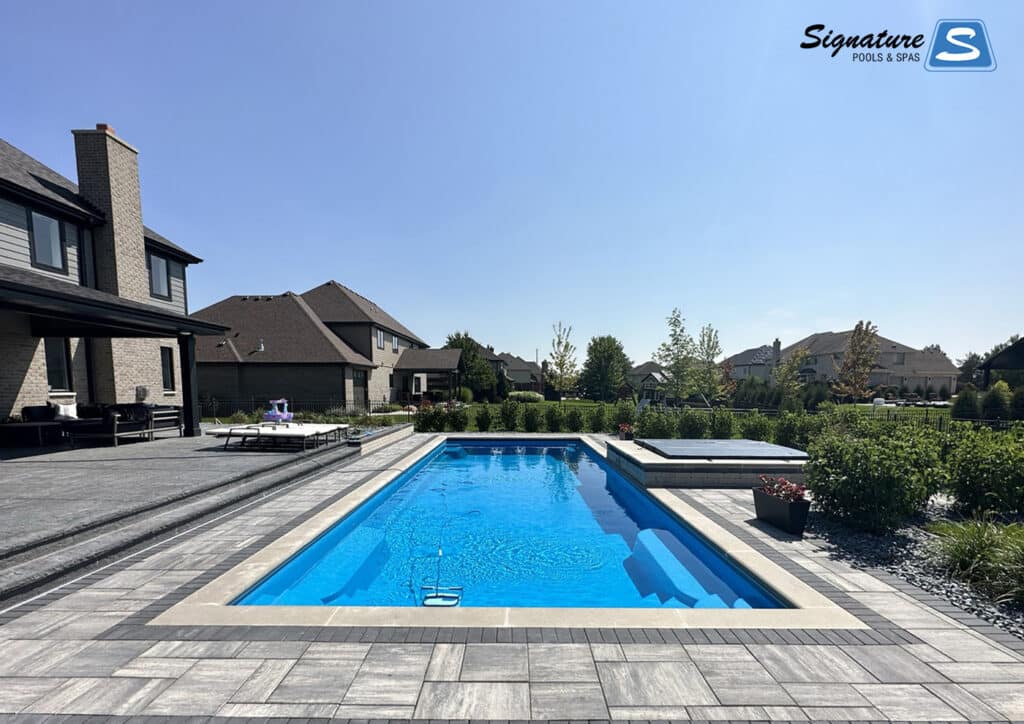 Goliath 1641 in California color with elevated spa built by Signature Pools in Frankfort, IL